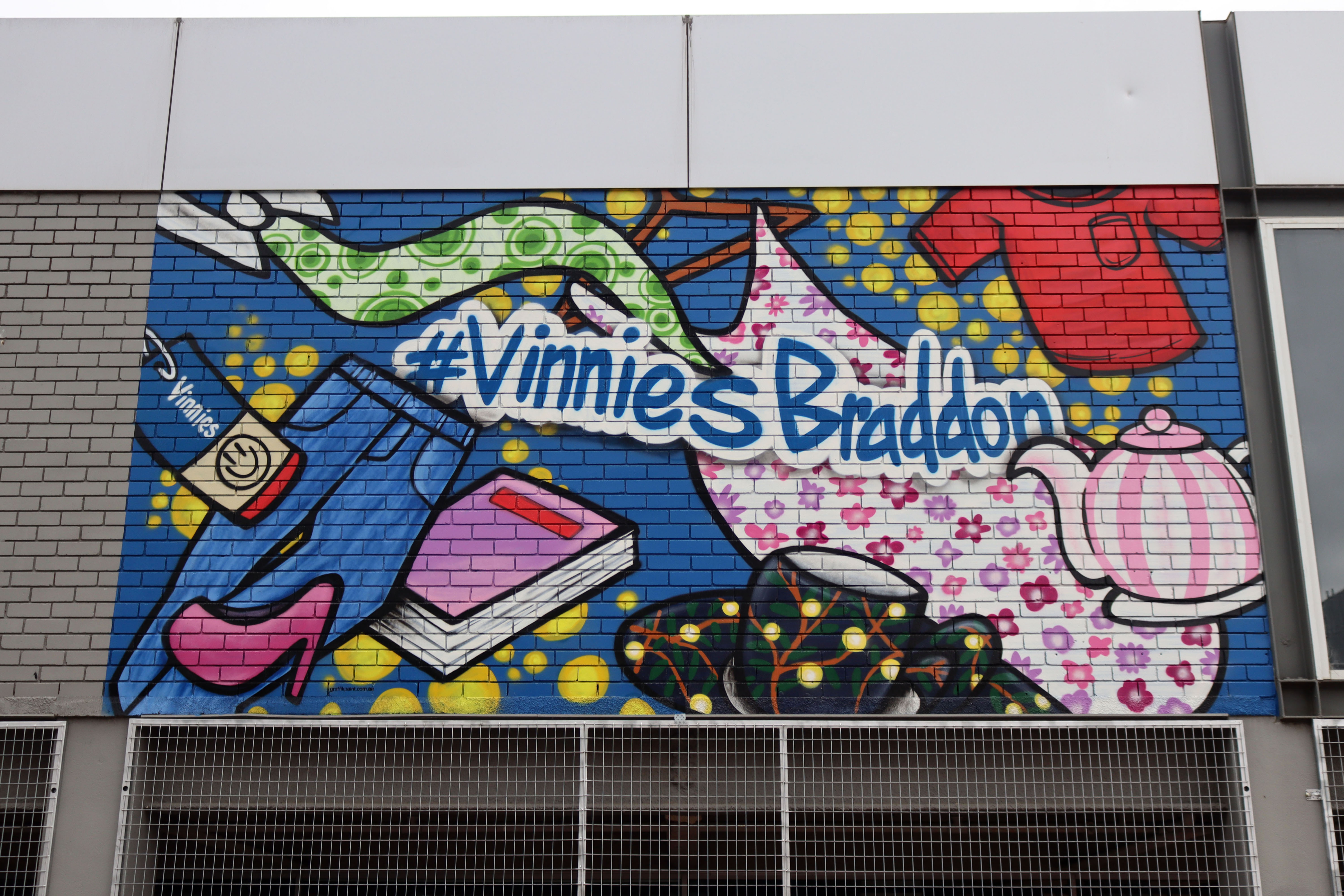 Vinnies Braddon by GraffikPaint | Street Art NSW