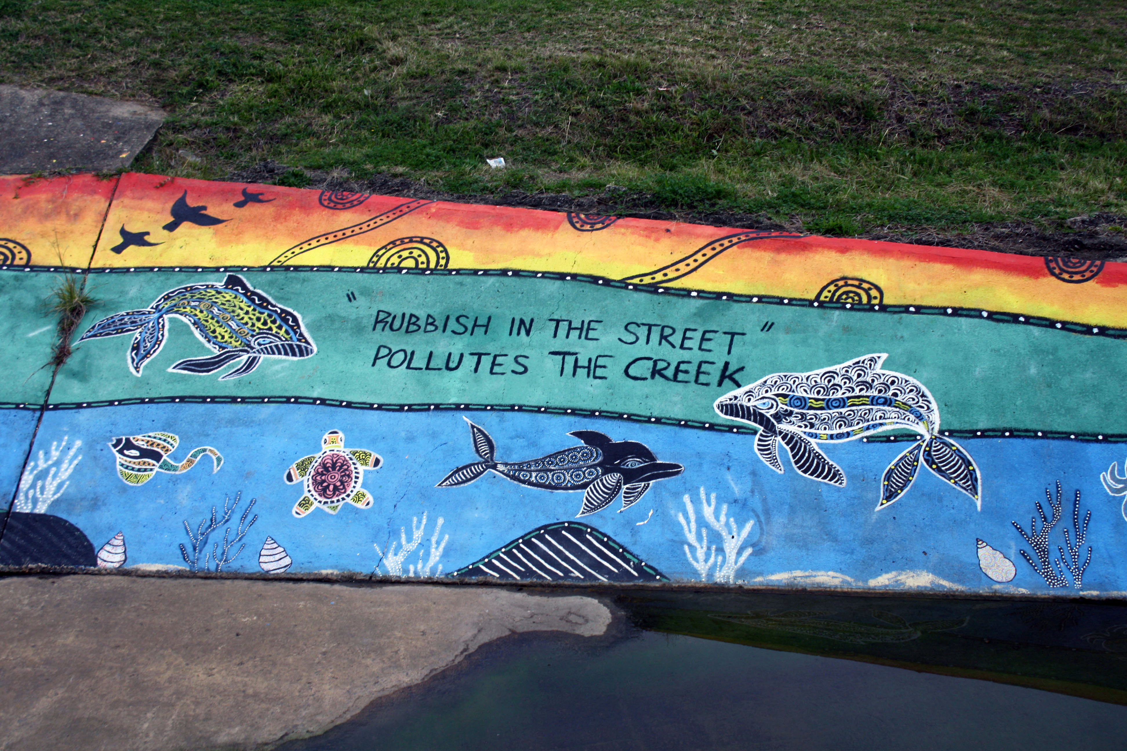 Rubbish in the Street Pollutes the Creek | Street Art NSW