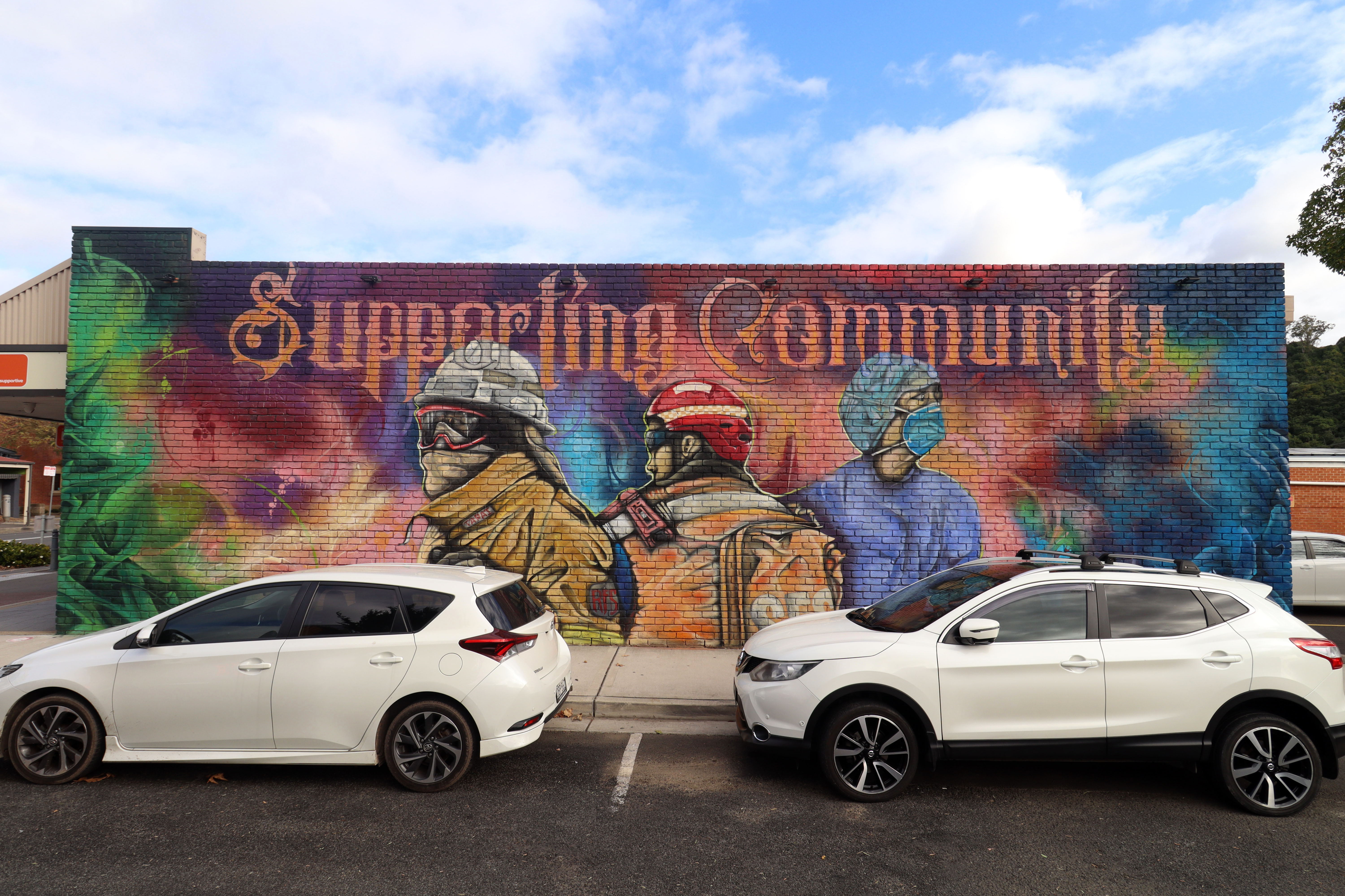 Supporting Community by Joe Quilter | Street Art NSW